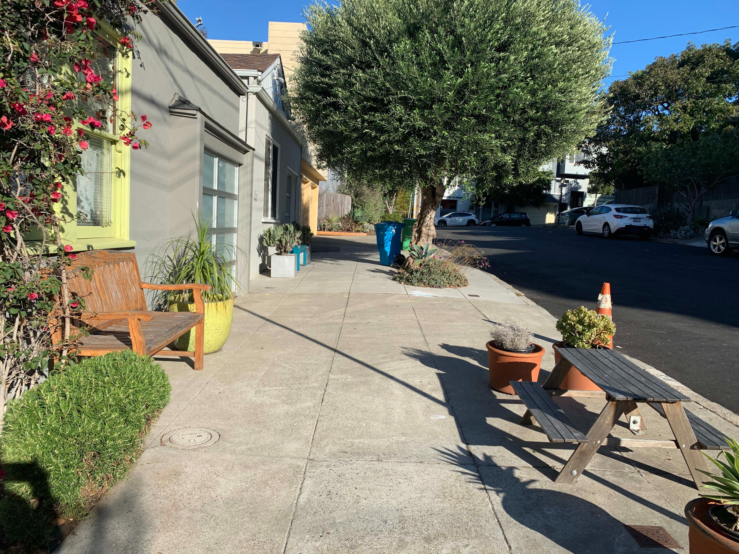 Plenty of seating, lush tree boxes, minimalist potted plants, and enough clearance for walking and rolling. Plus, nothing is too heavy.